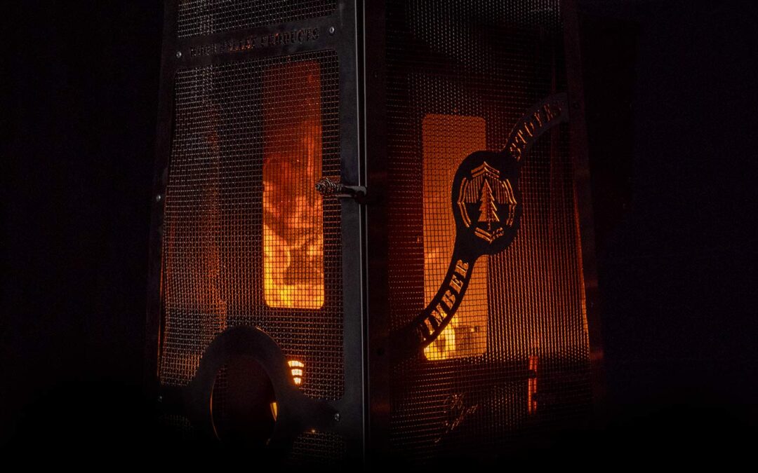 Timber Stoves wood-burning outdoor heater on a remote cabin deck under the stars